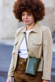 afro hairstyle, bag, beige jacket, brown pants, crossbody bag, freckles, hairstyle, jacket, khaki bag, large pants, leather bag, Odile Gautreau, pants, ribbed top, white top, natural makeup, fashion week, frenchystyle, FW, jonathan paciullo, street style, PFW, PARIS, SPRING SUMMER 2022, SS 22, vertical, atmosphere details