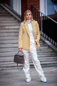 xenia adonts, light yellow jacket, beige jacket, white pullover, white pants, satin pants, turtleneck pullover, loose pants, hermes jacket, golden necklace, golden earrings, golden ring, multi earrings, big chain necklace, brown leather bag, hermes bag, kelly hermes bag, hoop earrings, mini hoop earrings, diamond earrings, white total look, beige total look, PARIS, PFW, fashion week, frenchystyle, FW, jonathan paciullo, street style, SPRING SUMMER 2021, SS 21, vertical, full length