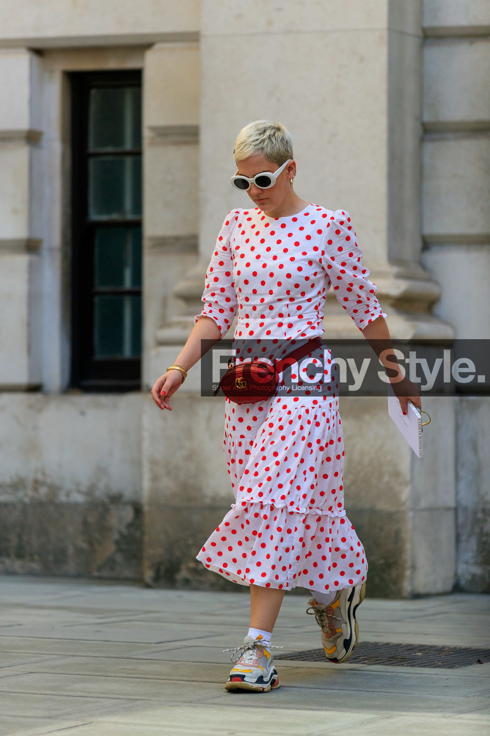 white sunglasses, polka dots dress, mid long dress, white dress, gucci bag, red leather bag, belt bag, multi earrings, golden earrings, hoop earrings, long sleeves dress, balenciaga sneakers, white sneakers, fashion week, frenchystyle, FW, jonathan paciullo, street style, vertical, full length