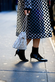 black dress, black shoes, black skirt, checked, fishnet, graphic jacket, graphic skirt, high heels, leather bag, leather shoes, plaid, prada, Preetma Singh, printed jacket, printed skirt, shiny bag, silver bag, silver coat, varnished leather shoes, street style, jonathan paciullo, frenchystyle, NYFW, NEW YORK, AUTUMN WINTER 2019-2020, AW 19-20, FALL WINTER 2019-2020, FW 19-20, fashion week, FW, vertical, atmosphere details, detail