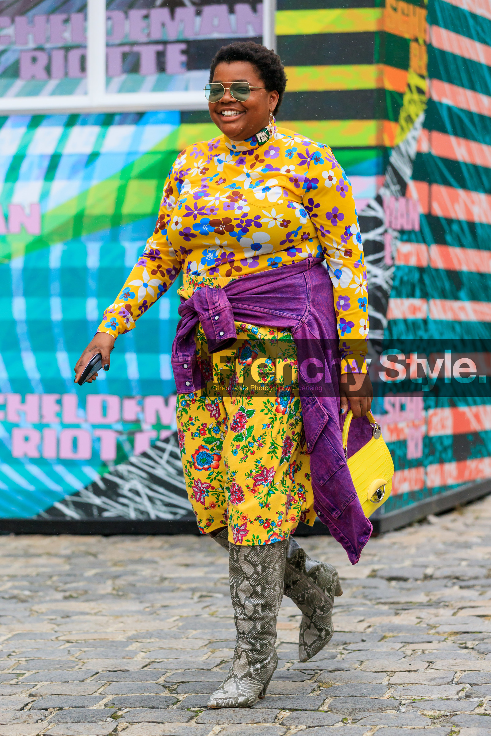gabriella karefa johnson, yellow top, yellow skirt, yellow leather bag, floral printed skirt, floral printed top, turtleneck top, prada top, mid long skirt, tight top, long sleeves top, purple jacket, denim jacket, beige leather boots, animal skin boots, high boots, green sunglasses, aviator sunglasses, metalic frame sunglasses, hand bag, animal skin bag, fashion week, frenchystyle, FW, jonathan paciullo, street style, PFW, PARIS, SPRING SUMMER 2020, SS 20, horizontal, full length