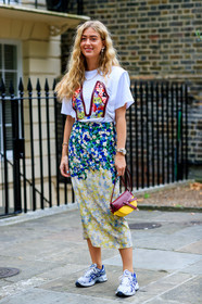 emili sindlev, floral print total look, white t-shirt, short sleeves t-shirt, floral printed skirt, floral printed t-shirt, mid long skirt, silk skirt, rolex watch, silvered and golden watch, silver and golden watch, man style watch, asics sneakers, silvered sneakers, white sneakers, blue sneakers, loewe bag, hand bag, burgundy leather bag, yellow leather bag, light green skirt, blue skirt, tie and dye skirt, pearl earrings, pearl necklace, fashion week, frenchystyle, FW, jonathan paciullo, street style, vertical, full length