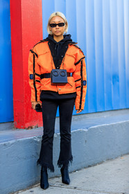 black bag, black belt, black denim, black shoes, black sweater, denim pants, fanny pack, graphic jacket, high heels, hoodie, jeans, leather bag, leather belt, leather shoes, orange jacket, printed jacket, sunglasses, trousers, street style, jonathan paciullo, FW, frenchystyle, fashion week, NYFW, NEW YORK, AUTUMN WINTER 2018-2019, AW 18-19, FALL WINTER 2018-2019, FW 18-19, vertical, full length, vanessa hong