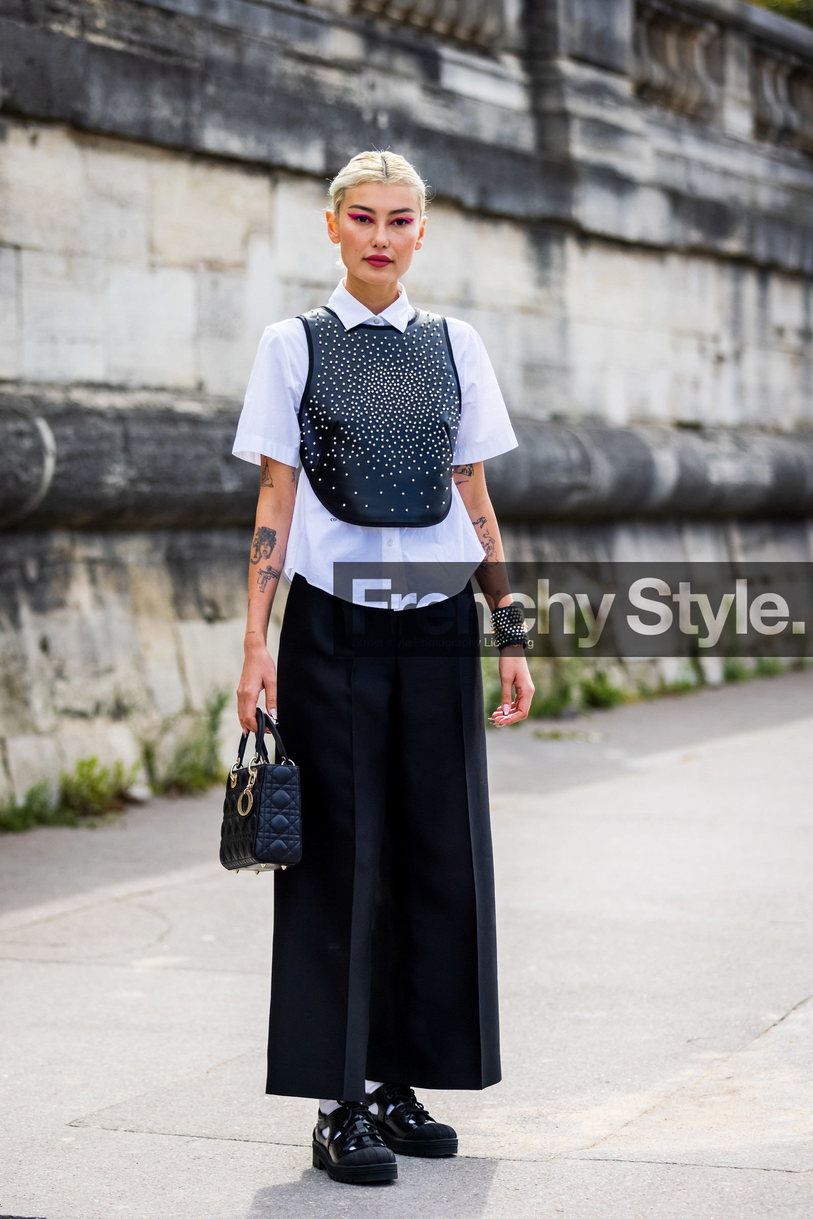 Amalie Gassmann, bag, black bag, black bracelet, black cuff, black derbies, black pants, derbies, dior bag, dior look, flare pants, large pants, leather bag, leather bracelet, leather derbies, leather top, pearl top, pink eyeliner, pleated pants, quilted bag, shirt, tattoo, white shirt, white sock, street style, jonathan paciullo, FW, frenchystyle, fashion week, PFW, PARIS, SPRING SUMMER 2022, SS 22, vertical, full length