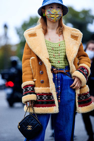 fiona kim, camel suede coat, camel coat, suede coat, fur coat, ethnic printed coat, ethnic printed jeans, flare jeans, patchwork coat, patchwork jeans, light green pullover, openwork pullover, long necklace, golden necklace, stone necklace, black leather bag, box bag, zipped bag, square shape bag, quilted bag, denim, denim hat, marine serre hat, monogrammed hat, chanel bag, chanel necklace, blue hat, covid face mask, PARIS, PFW, fashion week, frenchystyle, FW, jonathan paciullo, street style, SPRING SUMMER 2021, SS 21, vertical, atmosphere details, detail