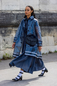 babies, bag, black babies, black bag, crossbody bag, dio raincoat, dior bag, dior look, dior print, dots, dots dress, dress, leather bag, logo print, navy skirt, patent babies, patent sandals, printed skirt, raincoat, rings, sock, transparent raincoat, white sock, street style, jonathan paciullo, FW, frenchystyle, fashion week, PFW, PARIS, SPRING SUMMER 2022, SS 22, vertical, full length