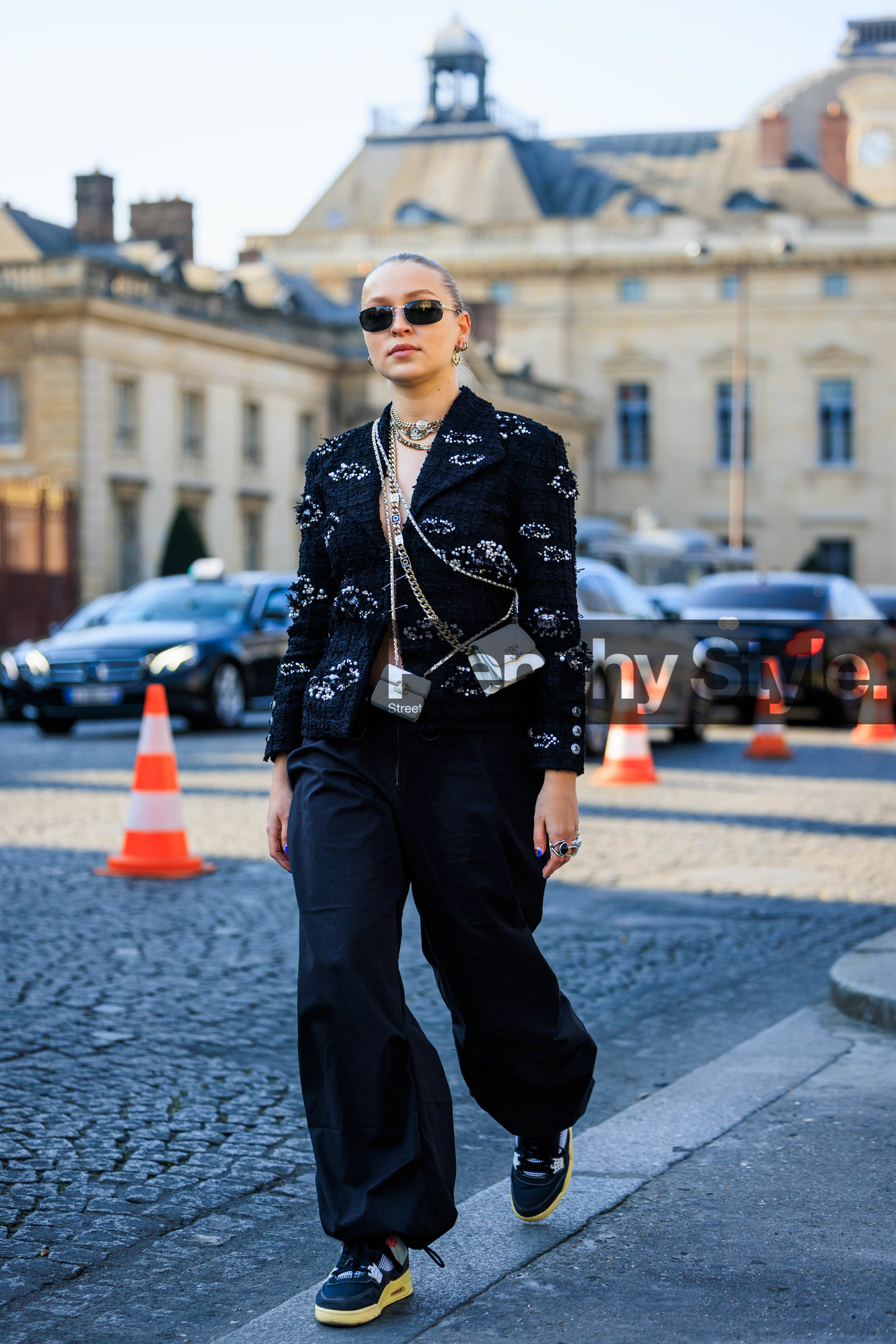 chanel blazer, tweed vest, printed vest, black sunglasses, chanel, mini handbag, chanel mini, white mini bag, baggy pants, black sneakers, multiple chokers, silver chokers, regina anikiy, street style, jonathan paciullo, FW, frenchystyle, fashion week, AUTUMN WINTER 2022-2023, FALL WINTER 2022_2023, FW 22-23, PFW, PARIS, full length, vertical
